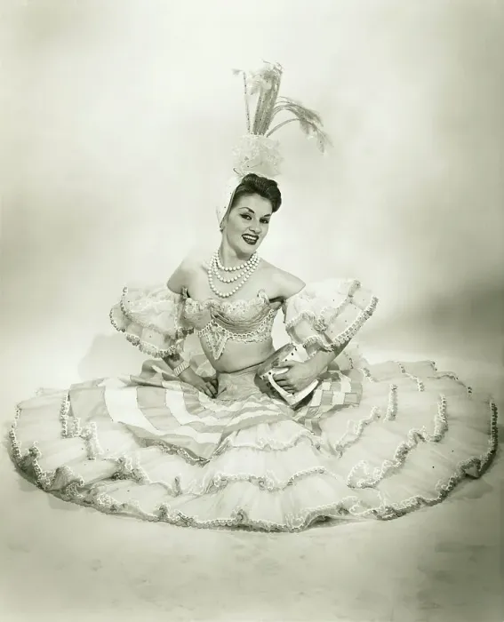 Framed Print : Woman in Latino dance costume sitting in studio, holding drum, (B&W) Framed Print : Woman in Latino dance costume sitting in studio, holding drum, (B&W)