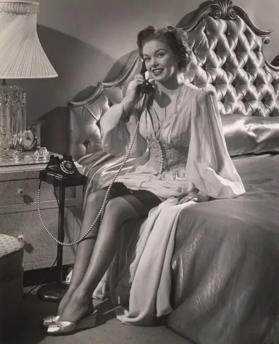 Framed Print : Woman in lingerie on phone in bedroom