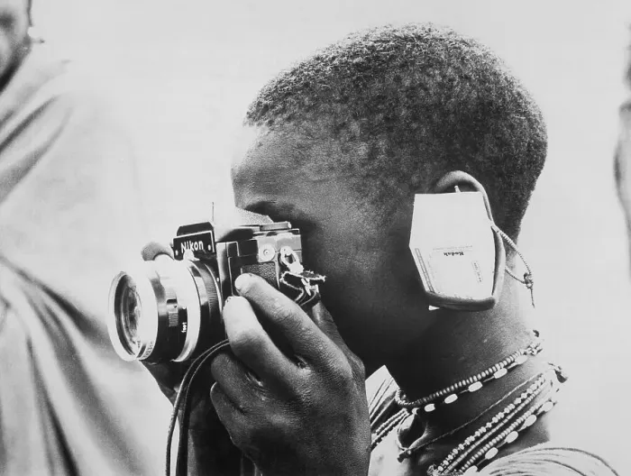 Framed Print : Woman Looking Through a Camera Framed Print : Woman Looking Through a Camera