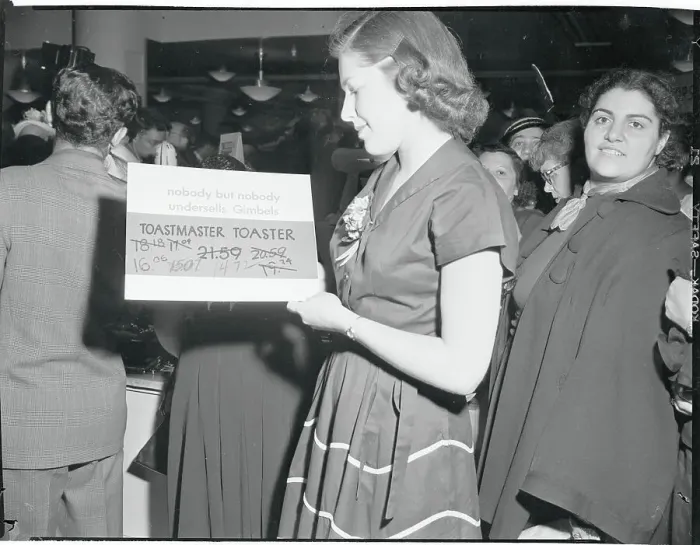 Framed Print : Woman Looking at a Price Card Framed Print : Woman Looking at a Price Card