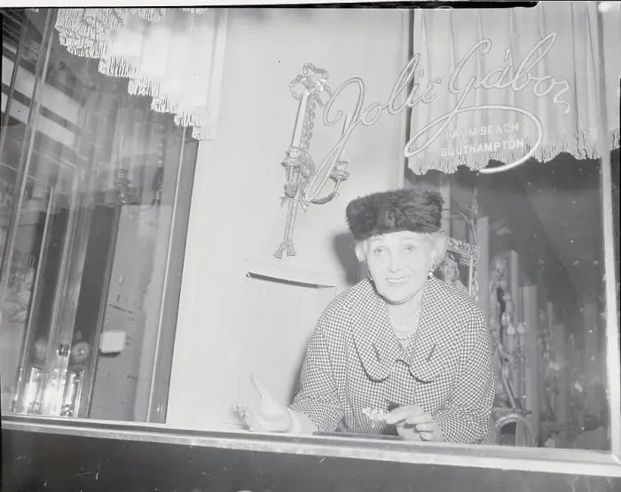 Framed Print : Woman Looking Through Store Window Framed Print : Woman Looking Through Store Window