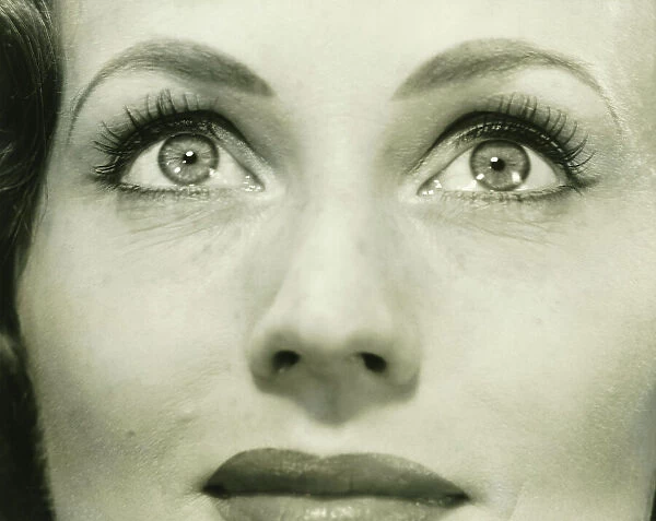 Woman looking up, (B&W), close-up, portrait