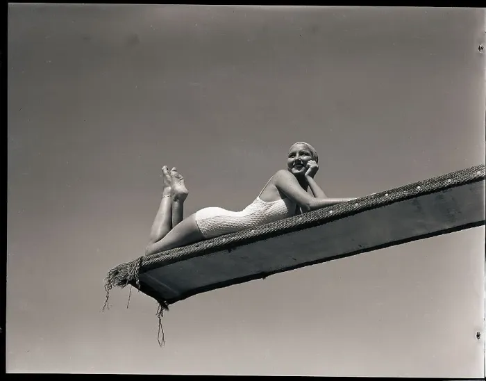 Framed Print : Woman Lying on Diving Board
