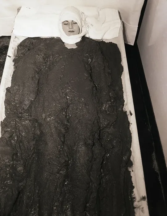 Framed Print : Woman Lying in Mud Bath