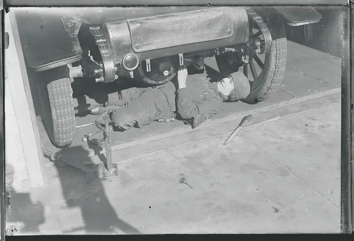 Framed Print : Woman Machinist Under Car Framed Print : Woman Machinist Under Car