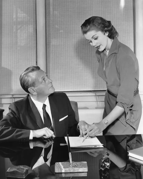 Framed Print : Woman and man talking and pointing to paper Framed Print : Woman and man talking and pointing to paper