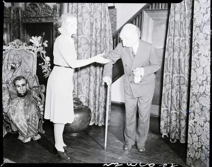 Framed Print : Woman in Mask Lends Hand to Man in Mask Framed Print : Woman in Mask Lends Hand to Man in Mask