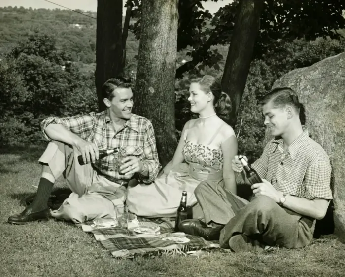 Framed Print : Woman and two men picnicking, (B&W)