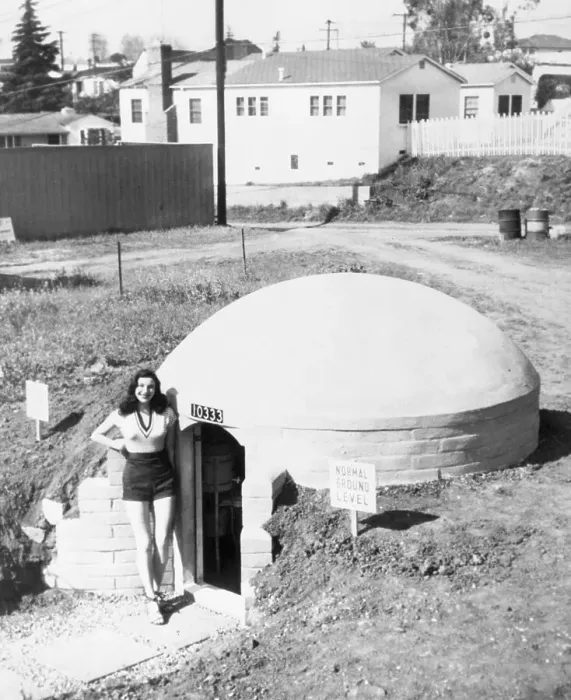 Framed Print : Woman Modeling a Bomb Shelterr Framed Print : Woman Modeling a Bomb Shelterr
