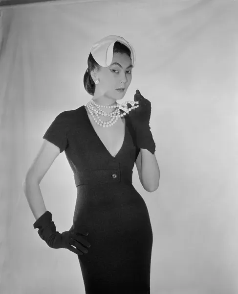 Christian Dior Print: Woman Modeling a Plunging Cocktail Dress