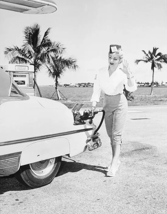 Framed Print : Woman Operating Gas Pump on Broad Causeway, Miami Framed Print : Woman Operating Gas Pump on Broad Causeway, Miami