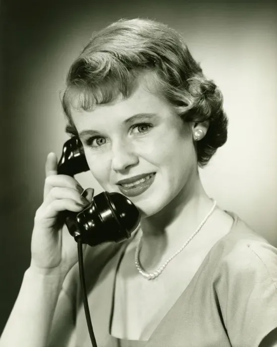 Framed Print : Woman on phone posing in studio, (B&W), (Close-up), (Portrait) Framed Print : Woman on phone posing in studio, (B&W), (Close-up), (Portrait)