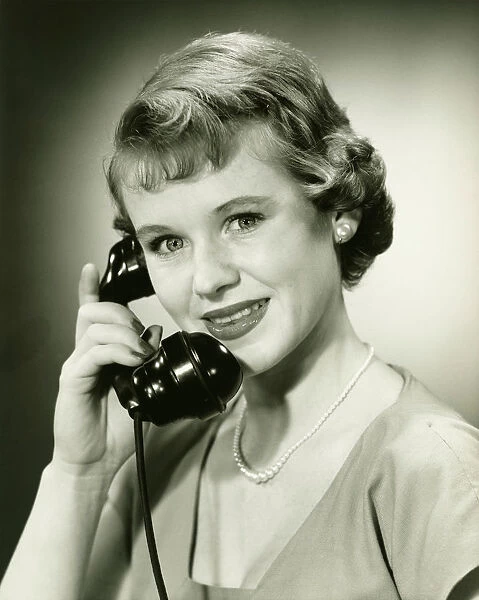 Woman on phone posing in studio, (B&W), (Close-up), (Portrait)