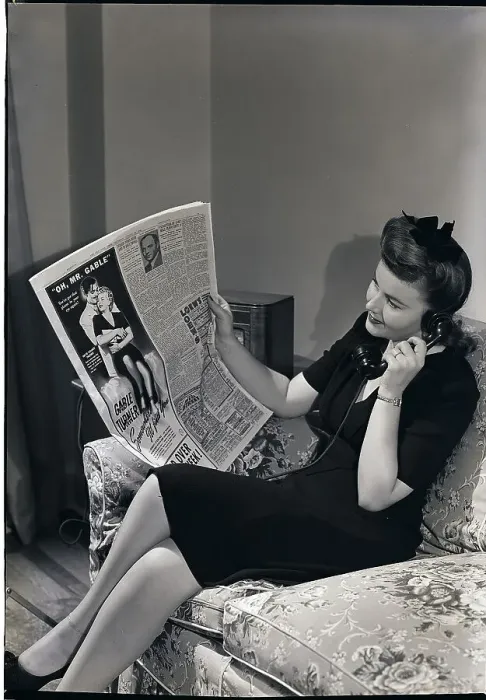 Framed Print : Woman on Phone Reading Newspaper Framed Print : Woman on Phone Reading Newspaper