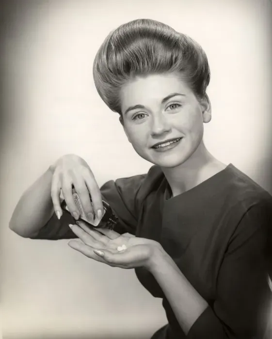 Framed Print : Woman with pill bottle and pills in hand Framed Print : Woman with pill bottle and pills in hand