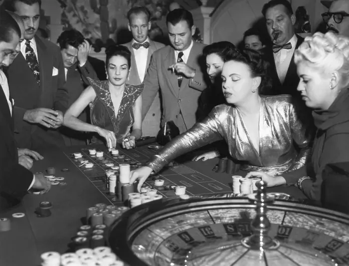 Framed Print : Woman Placing a Bet at a Roulette Wheel Framed Print : Woman Placing a Bet at a Roulette Wheel
