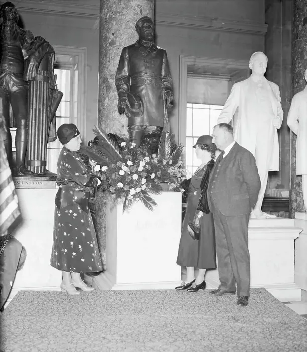 Framed Print : Woman Placing Wreath at Statue Framed Print : Woman Placing Wreath at Statue