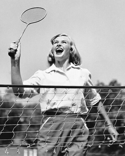 Woman playing badminton