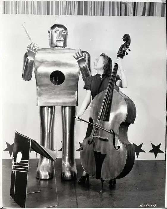 Framed Print : Woman Playing Cello as Robot Conducts Framed Print : Woman Playing Cello as Robot Conducts