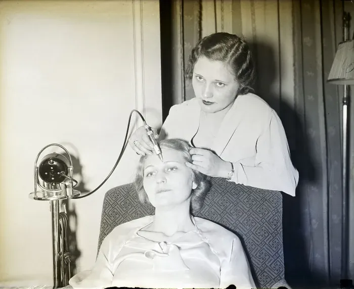 Framed Print : Woman Plucking Model's Eyebrows Framed Print : Woman Plucking Model's Eyebrows