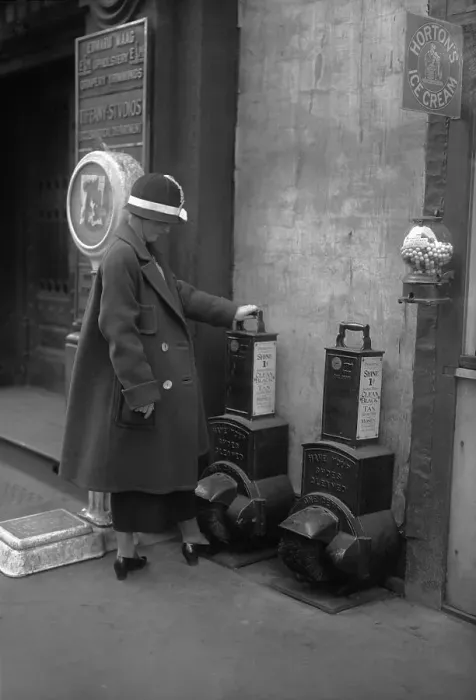 Framed Print : Woman polishing shoes on street Framed Print : Woman polishing shoes on street