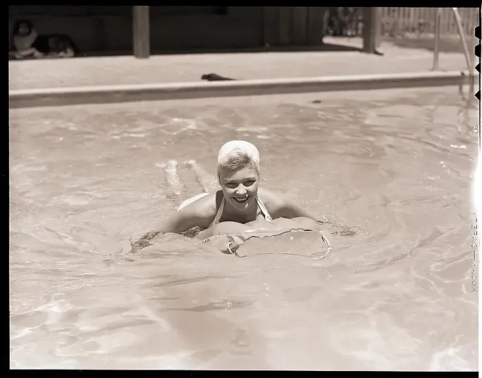 Framed Print : Woman in a Pool with an Air Mattress Framed Print : Woman in a Pool with an Air Mattress