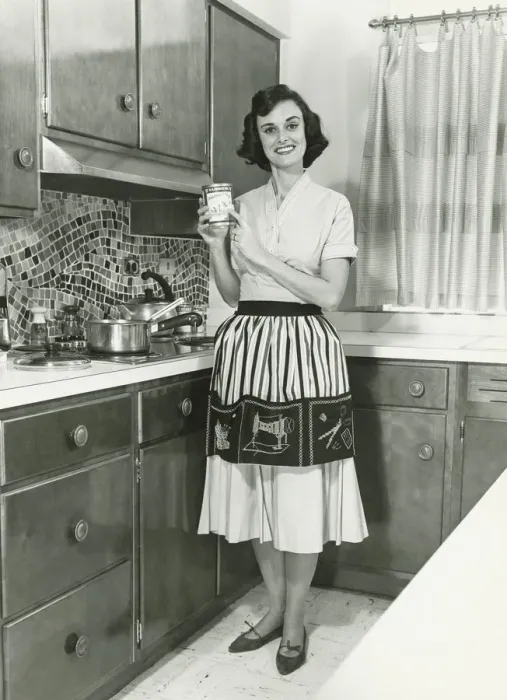 Framed Print : Woman posing in kitchen, (B&W), portrait Framed Print : Woman posing in kitchen, (B&W), portrait
