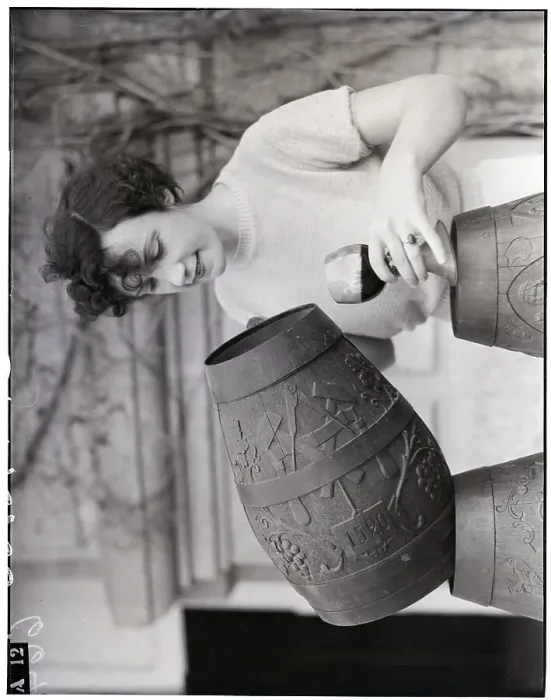 Framed Print : Woman Pouring Wine From Wooden Mug Framed Print : Woman Pouring Wine From Wooden Mug