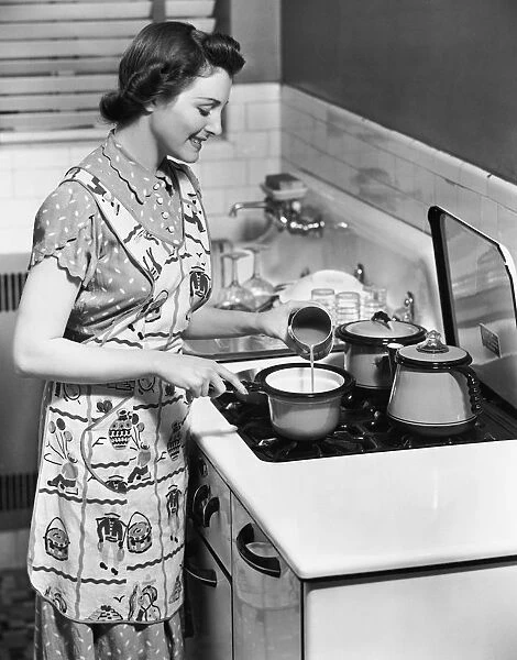Woman preparing food on stove
