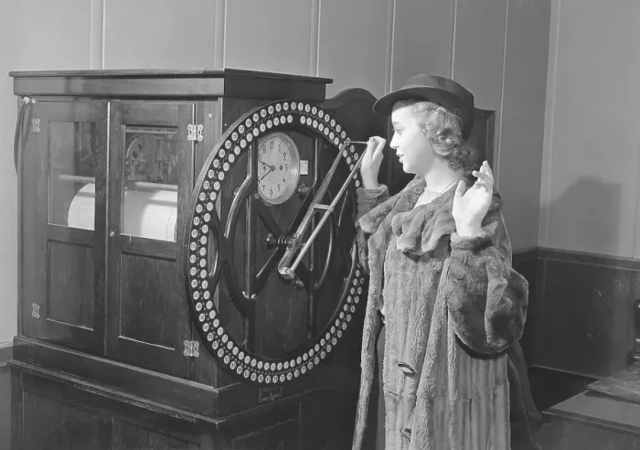 Framed Print : Woman Punching in on Rotary Time Clock Framed Print : Woman Punching in on Rotary Time Clock