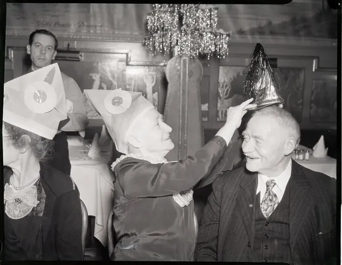 Framed Print : Woman Puts Hat On Man In Banquet Hall Framed Print : Woman Puts Hat On Man In Banquet Hall