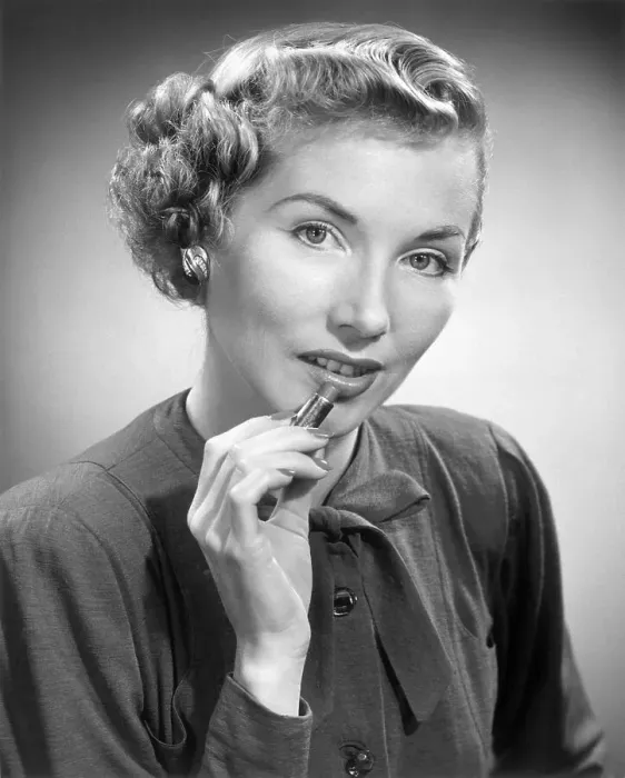 Framed Print : Woman putting on lipstick Framed Print : Woman putting on lipstick