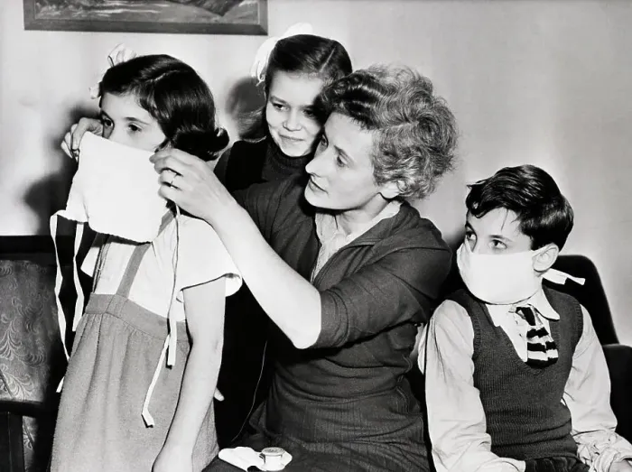 Framed Print : Woman Putting Mask On Children; Smog Framed Print : Woman Putting Mask On Children; Smog