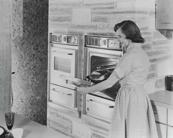 Framed Print : Woman Putting Roast in New Automatic Oven Framed Print : Woman Putting Roast in New Automatic Oven