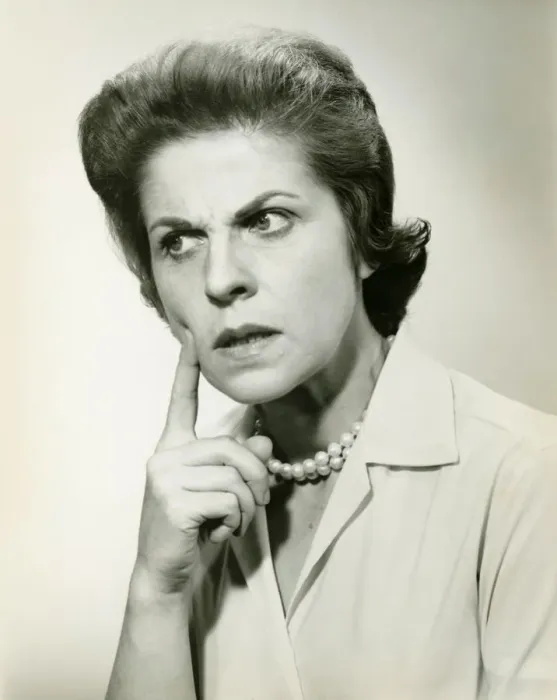 Framed Print : Woman with puzzled expression, in studio, (B&W), portrait Framed Print : Woman with puzzled expression, in studio, (B&W), portrait