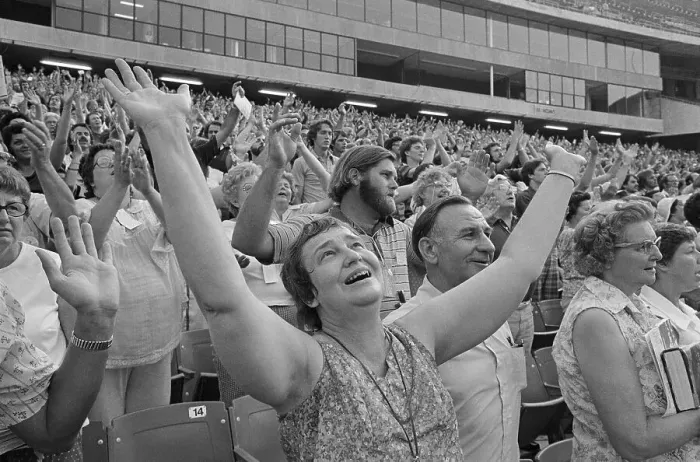 Framed Print : Woman Raising Arms at Religious Conference Framed Print : Woman Raising Arms at Religious Conference