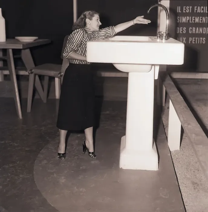Framed Print : Woman Reaches For Oversized Faucet Framed Print : Woman Reaches For Oversized Faucet