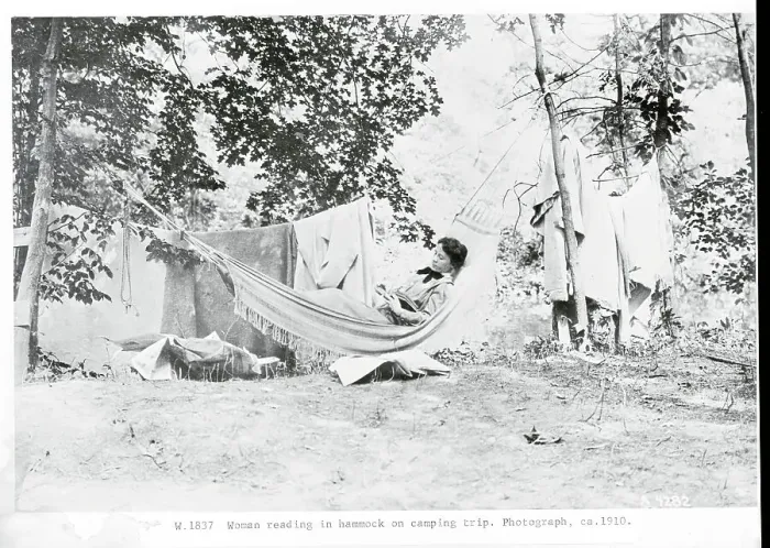 Framed Print : Woman Reading in Hammock During Camping Trip