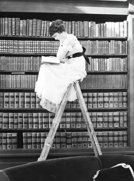 Framed Print : Woman Reading on Top of Ladder Framed Print : Woman Reading on Top of Ladder