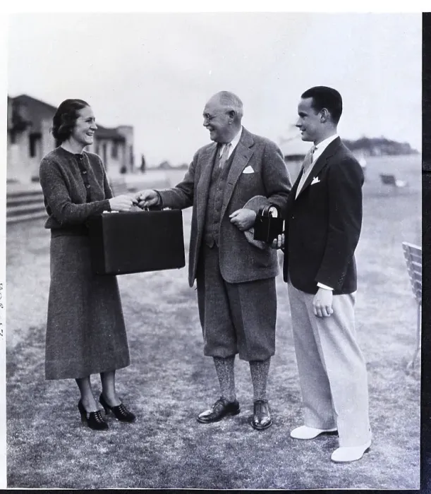 Framed Print : Woman Receives Briefcase with Prize Framed Print : Woman Receives Briefcase with Prize