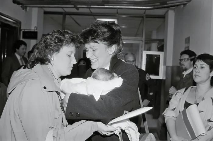 Framed Print : Woman Receiving Baby Framed Print : Woman Receiving Baby