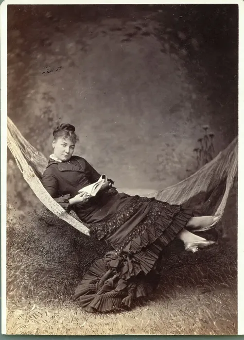 Framed Print : Woman Relaxing in Hammock with Book Framed Print : Woman Relaxing in Hammock with Book