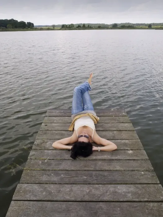 Framed Print : Woman relaxing lying on a wooden pier at a lake, Mecklenburg Lake District, Mecklenburg-Western Pomerania, Germany, Europe Framed Print : Woman relaxing lying on a wooden pier at a lake, Mecklenburg Lake District, Mecklenburg-Western Pomerania, Germany, Europe