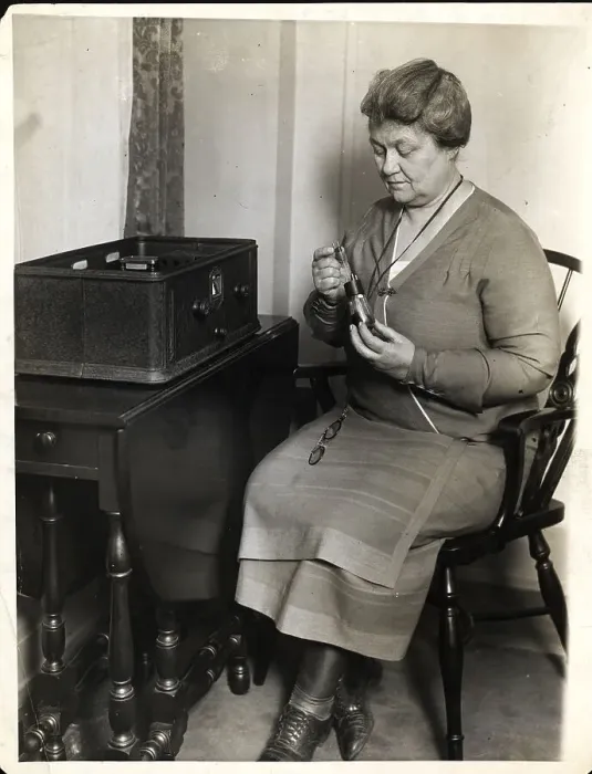 Framed Print : Woman Repairs Vacuum Tube For Radio Framed Print : Woman Repairs Vacuum Tube For Radio