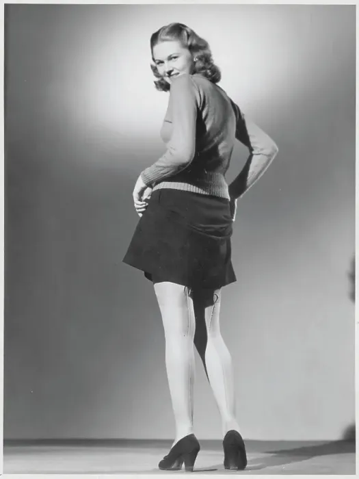 Framed Print : Woman Revealing Seamed Nylon Stockings Framed Print : Woman Revealing Seamed Nylon Stockings