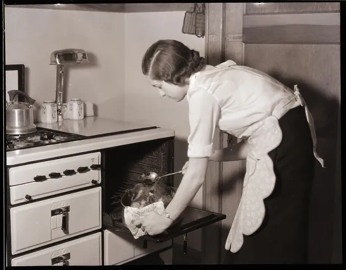 Framed Print : Woman Roasting a Turkey Framed Print : Woman Roasting a Turkey