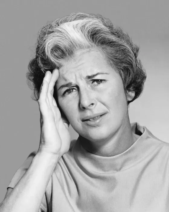 Framed Print : Woman rubbing forehead Framed Print : Woman rubbing forehead