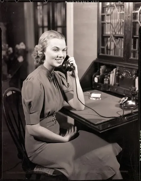 Woman Seated at Desk Talking on Phone Print, Ca. 1950s. Art Prints