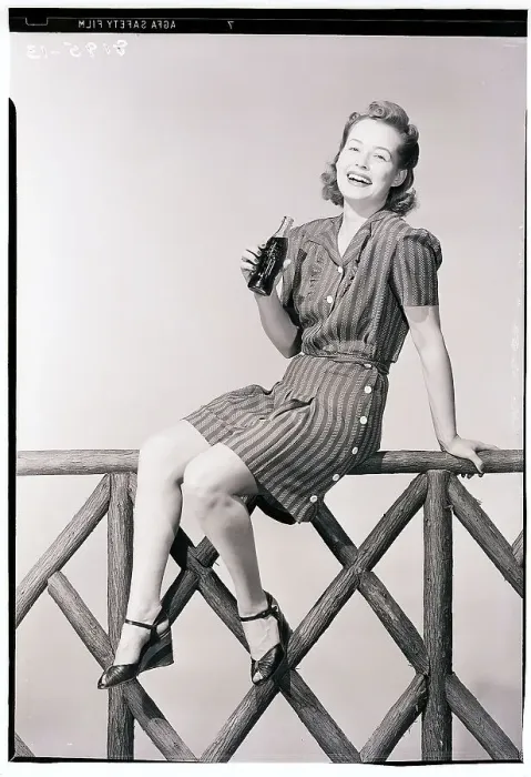 Framed Print : Woman Seated on Fence with Bottle of Soda Framed Print : Woman Seated on Fence with Bottle of Soda