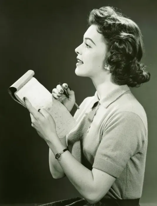 Framed Print : Woman secretary making notes in notebook, (B&W) Framed Print : Woman secretary making notes in notebook, (B&W)